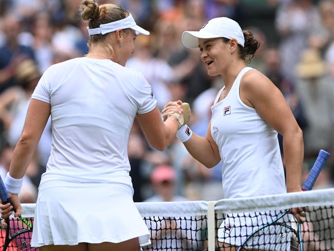 Australia’s Ashleigh Barty (right) shakes hands at the net with Russia’s Anna Blinkova. Picture: AFP