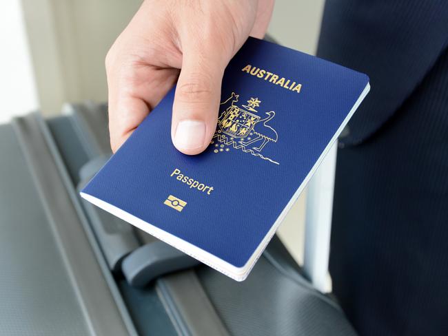 Traveller holding  an Australian passport.Photo - istockESCAPE 8 May 2022Doc holiday