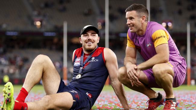 Hibberd laps up the premiership win with runner Shannon Byrnes.