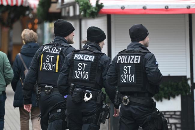 Police patrol near closed Christmas market shops three days after a car-ramming attack on the Christmas market in Magdeburg