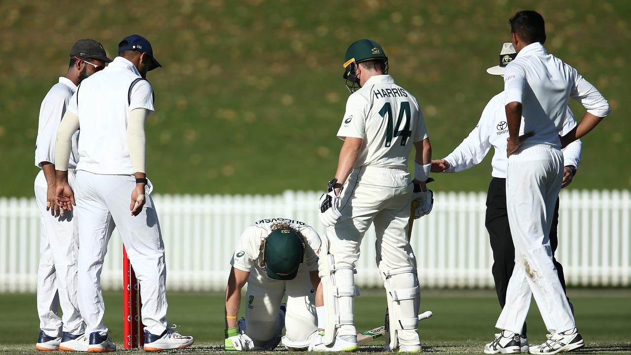 Players from both sides rush to Pucovski’s aid.