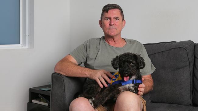 Craig Michaels and puppy Jackson are living with mould in his apartment in Summer Hill in Sydney. Picture: Daily Telegraph/ Gaye Gerard