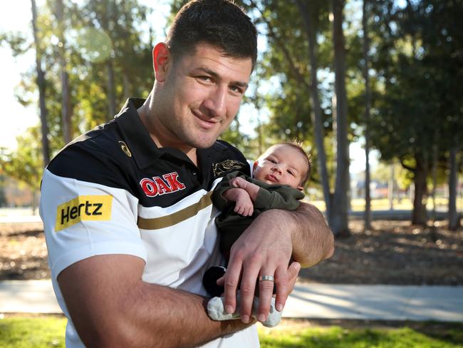 Penrith Panther Sam McKendry with his baby boy Isaac in 2017. Picture: Richard Dobson