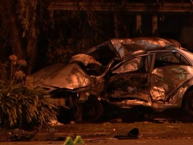 A silver sedan smashed through a brick fence. Picture: Nine News