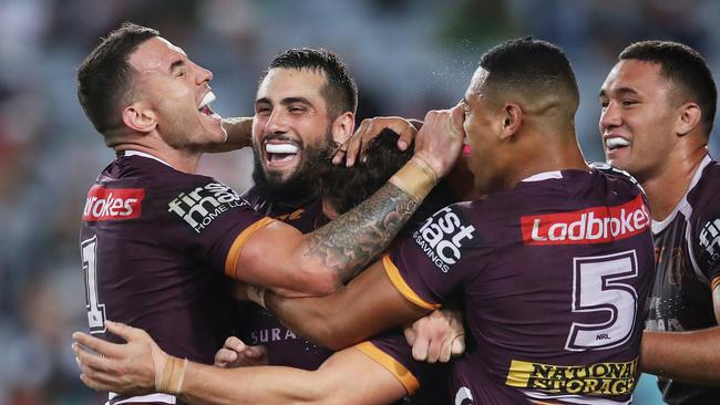 Darius Boyd and Jack Bird celebrate James Roberts’ try. (Phil Hillyard)