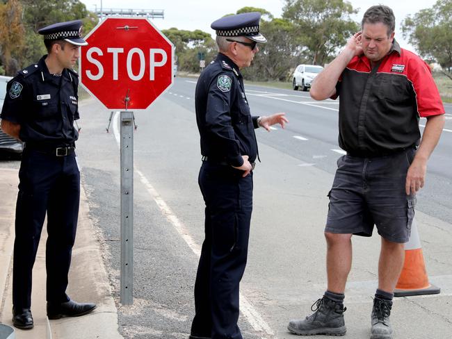 South Australian Police Commissioner Grant Stevens, centre, at the Pinnaroo fruit fly inspection point on the Mallee Highway near the Victorian border. Picture Dean Martin