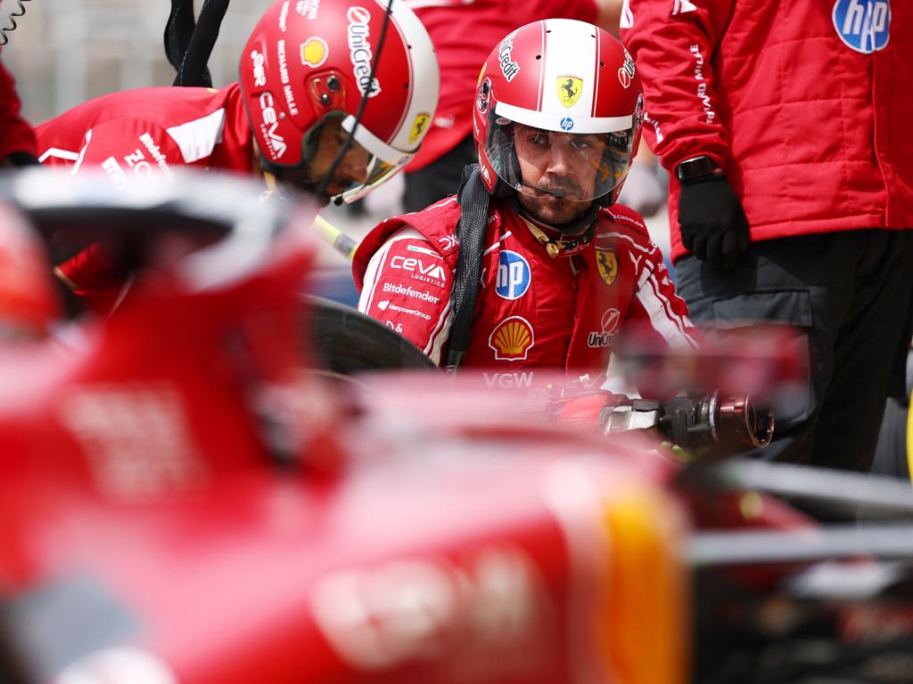 A member of the Scuderia Ferrari pit crew looks on as he prepares for a pit stop during day three of F1 testing at Bahrain International Circuit on February 28 in Bahrain, Bahrain. Picture: Clive Rose/Getty Images