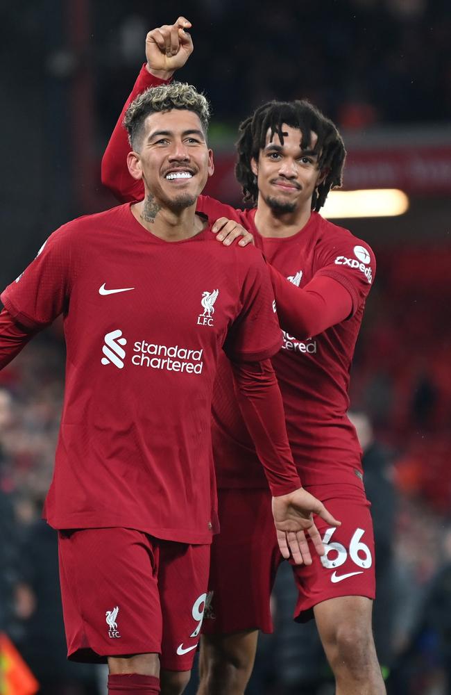 Roberto Firmino celebrates after scoring the team's seventh goal with teammate Trent Alexander-Arnold. (Photo by Michael Regan/Getty Images)