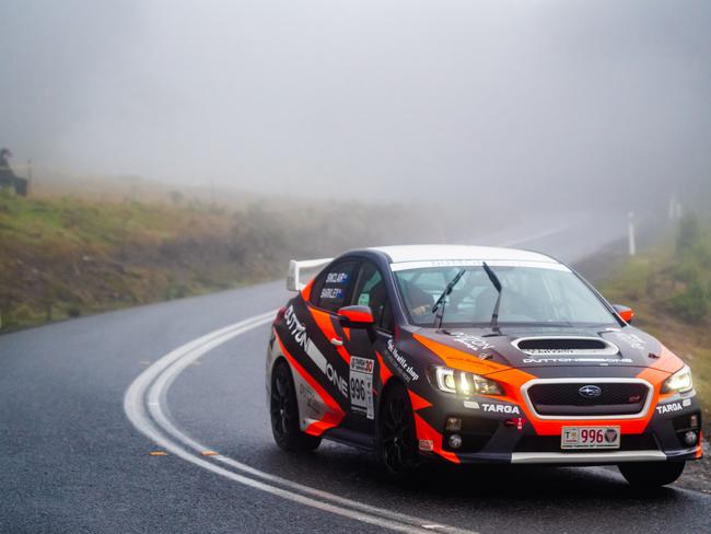 GTP entrants Mike Sinclair, of Victoria, and Julia Barkley, of NSW, on top of the Sideling in their 2021 Subaru WRX STi. Picture: Other Side Productions Targa Tasmania 2022