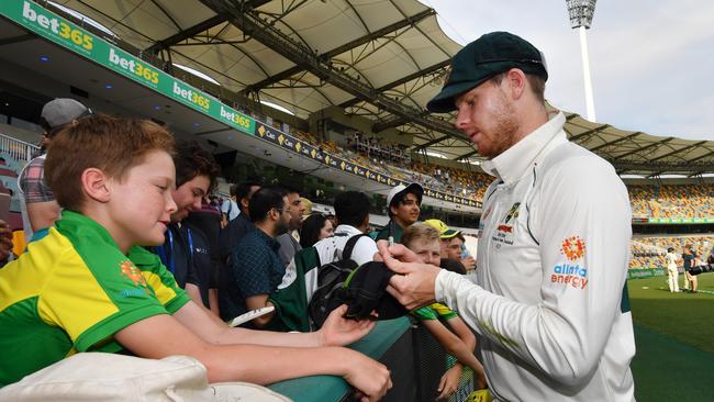 Steve Smith signs autographs for fans after Australia’s day four victory over Pakistan. Picture: AAP