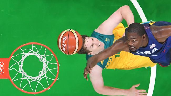 USA's guard Kevin Durant and Australia's forward Cameron Bairstow go for a rebound.