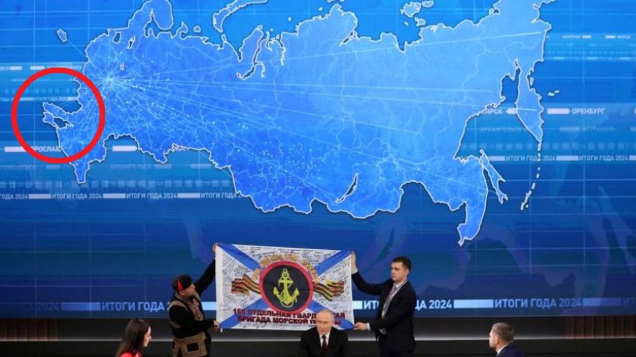 A map begin Putin showed Russia, with invaded areas of Ukraine added in.