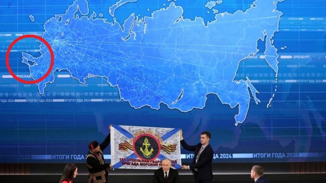 A map begin Putin showed Russia, with invaded areas of Ukraine, added in.