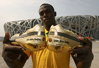 Premonition ... Bolt with his gold spikes before the 100m final. Reuters