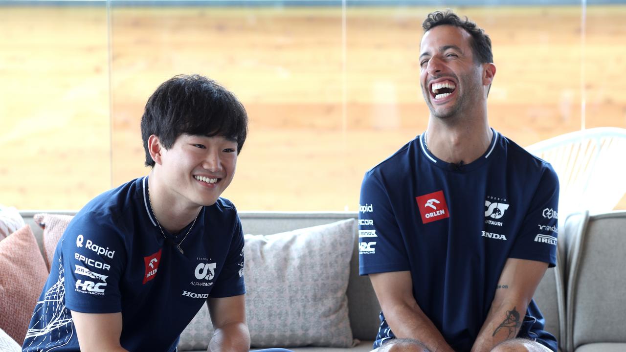 Yuki Tsunoda of Japan and Scuderia AlphaTauri and Daniel Ricciardo of Australia and Scuderia AlphaTauri talk to the media in the Paddock during previews ahead of the F1 Grand Prix of Hungary at Hungaroring on July 20, 2023 in Budapest, Hungary. (Photo by Peter Fox/Getty Images)