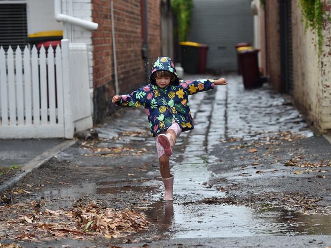 One child enjoy the change of weather. Picture: Nicki Connolly