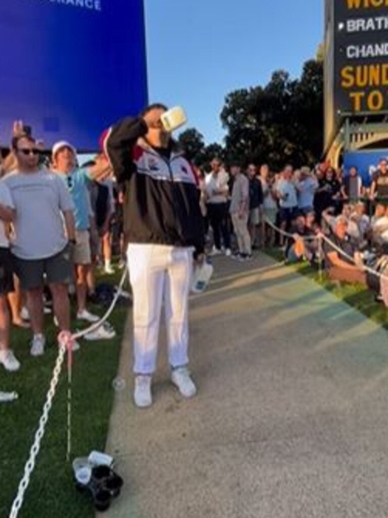 A man skols what appears to be milk at Adelaide Oval Picture: Supplied