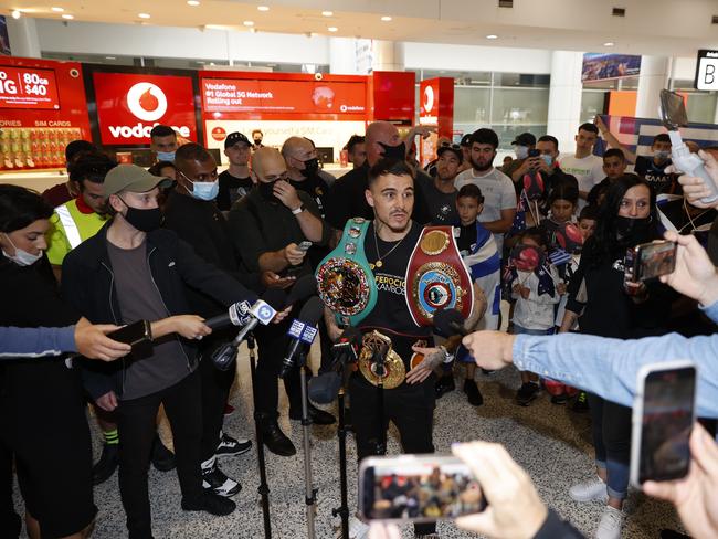 George Kambosos Jr talks to the media after arriving home in Sydney to much fanfare. Picture: Tim Hunter