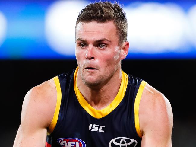 ADELAIDE, AUSTRALIA - JULY 20: Brad Crouch of the Crows runs with the ball during the round 7 AFL match between the Adelaide Crows and the St Kilda Saints at Adelaide Oval on July 20, 2020 in Adelaide, Australia. (Photo by Daniel Kalisz/Getty Images)