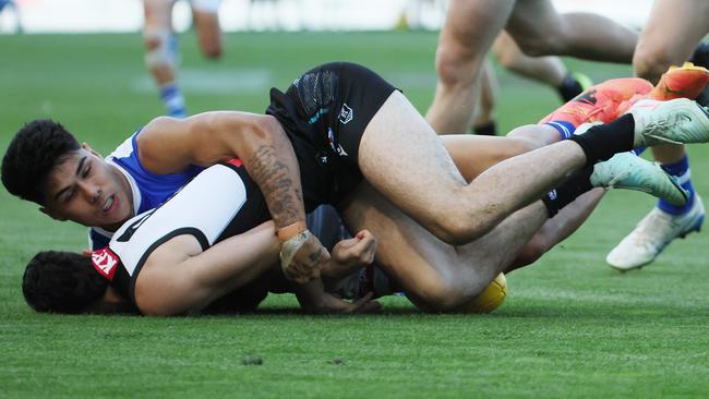 Josh Sinn of the Power is tackled by Paul Curtis (Photo by James Elsby/AFL Photos via Getty Images)