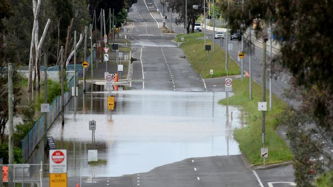 Floodwaters block the south-bound lanes of Bulleen Rd at Bulleen. Picture: Andrew Henshaw