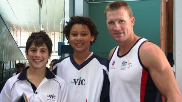 Petracca, Simmons and now-Collingwood coach Nathan Buckley at a Victorian School Sports event.