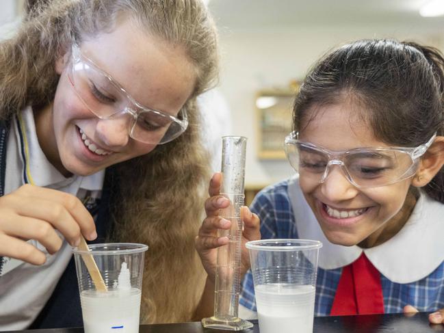 LIVERPOOL LEADER/AAP. Thomas Hassall Anglican College is holding it's annual 'Experience Year 7 for a day' event for local Year 6 students. Ashlyn Cook 12 from Hinchinbrook Public School and junior school student Chelsea Shah11 making slime. Photographed today 3rd May 2019. (AAP/Image Matthew Vasilescu