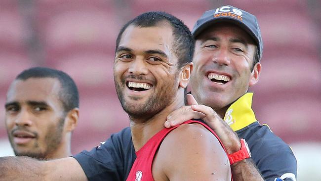 Karmichael Hunt with Reds Coach Richard Graham, and Will Genia (back) at Qld Reds training Ballymore. Pic Jono Searle.