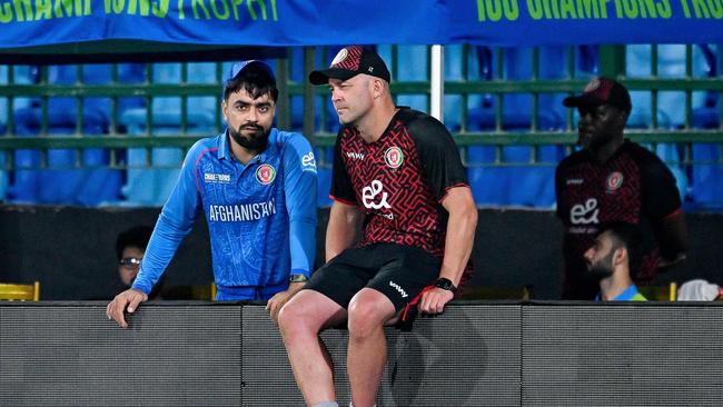 Afghanistan's Rashid Khan (left) and head coach Jonathan Trott. Picture: Asif Hassan / AFP