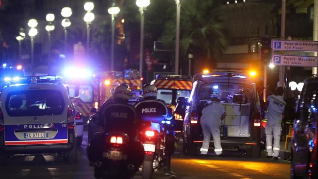 Police officers and rescue workers arrive at the scene of the attack which killed 84. <i>AFP PHOTO / VALERY HACHE</i>