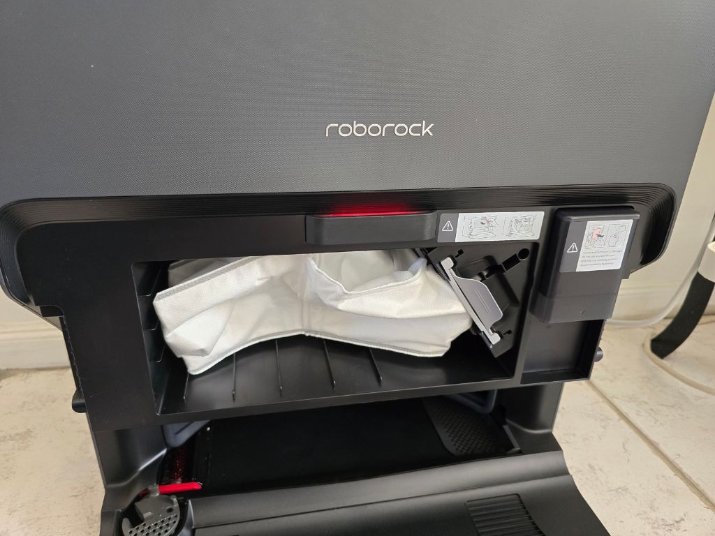 Take off the metallic panel to find the dust bag and compartment for your Roborock-approved cleaning solution. Picture: news.com.au/Tahnee-Jae Lopez-Vito