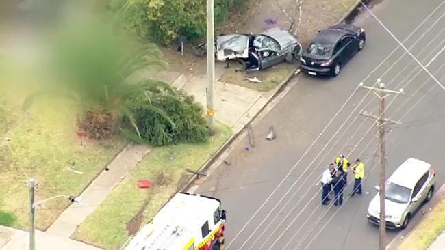 Aerial shots of the crash scene show the grey Ford Falcon split in two from the crash impact.