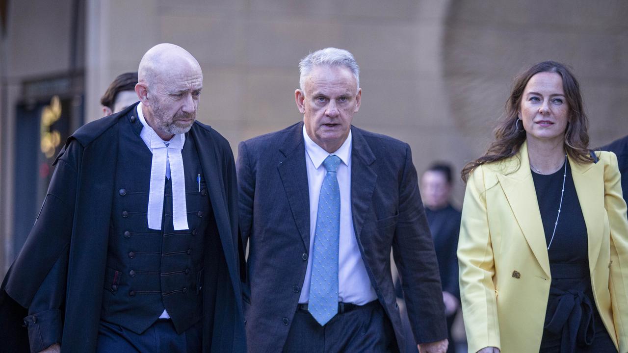 Mark Latham, centre, with barrister Mr Kieran Smark SC, left. Picture: NewsWire / Christian Gilles