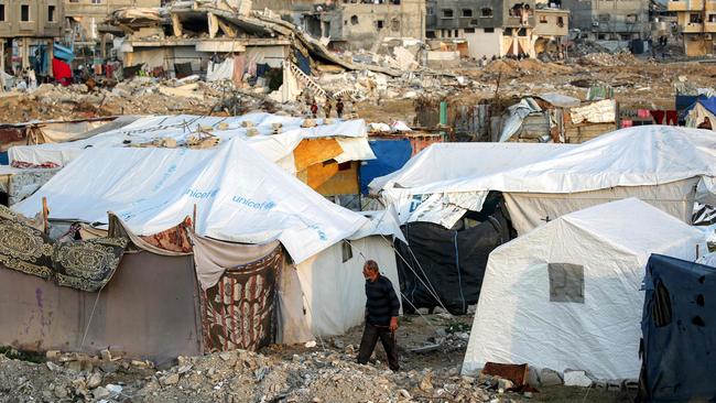 A man walks past tents at a camp for people displaced by conflict in Bureij in the central Gaza Strip on January 17, 2025. Picture: Eyad Baba/AFP