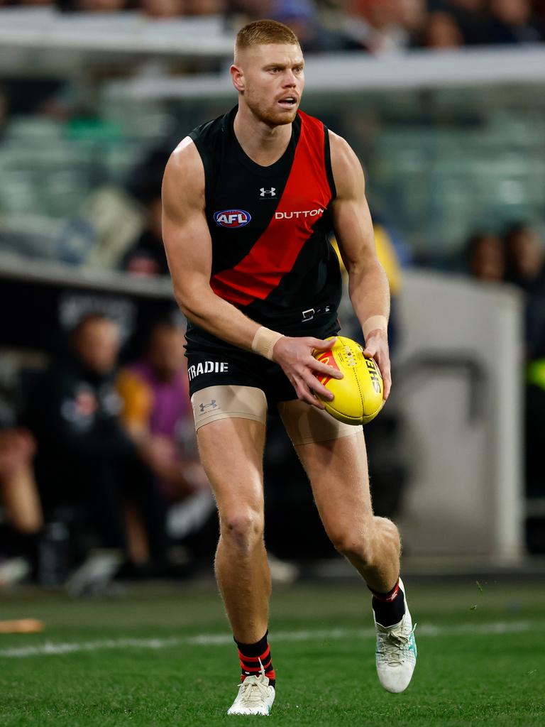 Peter Wright appears on the fringe of the Essendon side. Picture: Michael Willson/AFL Photos via Getty Images.