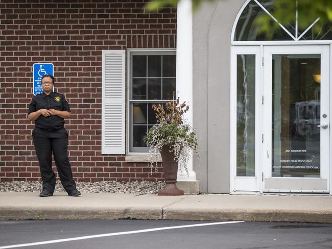 Open for business ... a security guard stands outside Dr Walter Palmer's office in Bloomington, Minnesota, as it reopens. Picture: Renee Jones Schneider/Star Tribune via AP