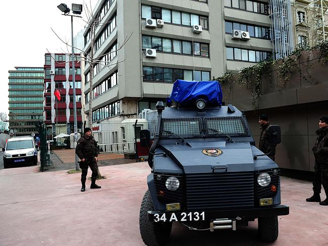 On guard ... Turkish special force police stand guard outside the Cumhuriyet Daily Newspaper building on in Istanbul. Picture: AFP