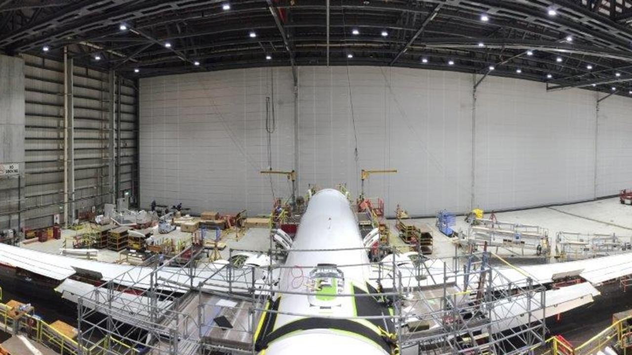 A Qantas 737 being fitted with hardware for high speed Wi-Fi in 2017.