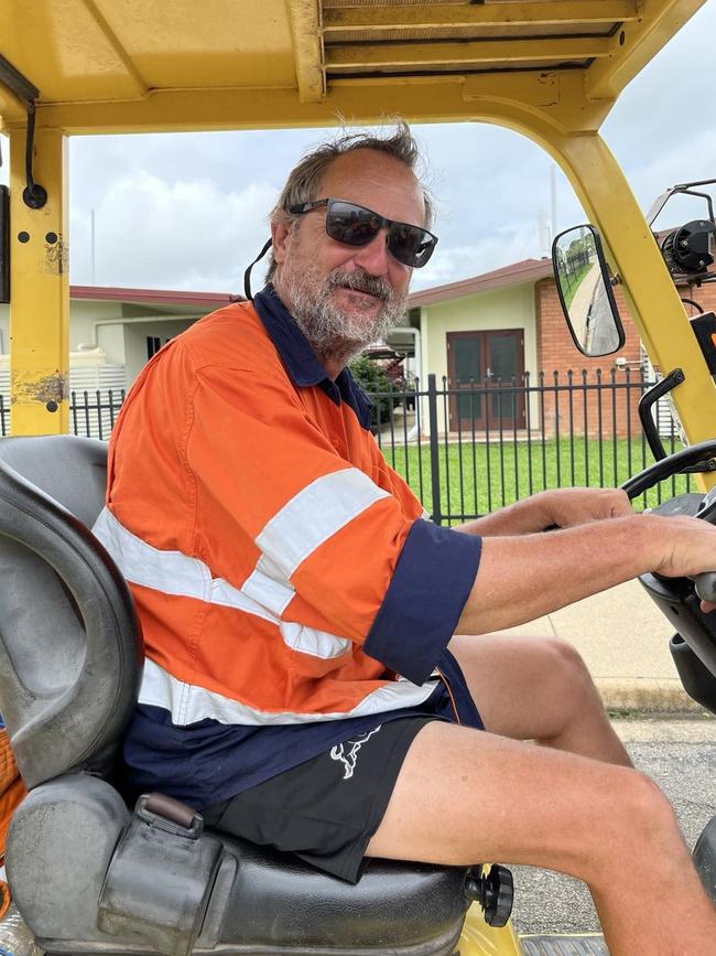 Floody legend Alan Watts working quickly and efficiently to unload four pallets of grocery supplies a Singapore air force CH-47F Chinook Helicopter landing outside Ingham State High School on Sunday. The floods in Hinchinbrook Shire, North Queensland. Picture: Cameron Bates