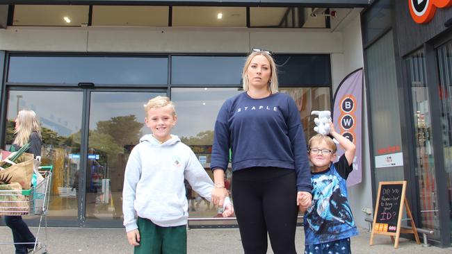 Mel Rodakis, 33, with her sons Jackson, 8, and Lucas, 4, outside her local supermarket in Cowes.