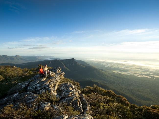 <span>34/50</span><h2>Grampians National Park, VIC</h2><p>The soaring mountains, bursting wildflowers, lake and bushland of the Grampians have long sung a siren song for Melbournites hungry for a weekend getaway. <a href="https://www.escape.com.au/destinations/australia/victoria/best-places-to-camp-in-the-grampians/news-story/05db8cb99ec859916afa1f741a763d95" target="_blank" rel="noopener">Multi-day walks and camping</a> are a specialty of the region, with natural sites such as The Pinnacle lookout, Mackenzie Falls and The Balconies being crowd favourites amongst hikers. Plus, <a href="https://www.escape.com.au/destinations/australia/victoria/the-grampians-in-western-victoria-cellars-galore-but-without-the-crowds/news-story/b69181fea9a0289d5d2e0ac149f0e67f" target="_blank" rel="noopener">did we mention the wineries</a>? Shiraz and Cab Sav are a specialty of the region. Picture: Robert Blackburn / Visit Victoria</p>