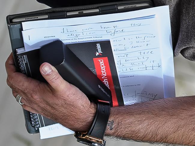 Portuguese football manager Jose Mourinho is pictured carrying written notes as he returns to his home in London on May 24, 2016. Mourinho is on the verge of fulfilling his dream of managing Manchester United after Louis van Gaal's troubled two-year reign at Old Trafford came to a bitter end. Van Gaal said he was "very disappointed" to be sacked on May 23, just 48 hours after leading United to victory in the FA Cup final against Crystal Palace. / AFP PHOTO / LEON NEAL