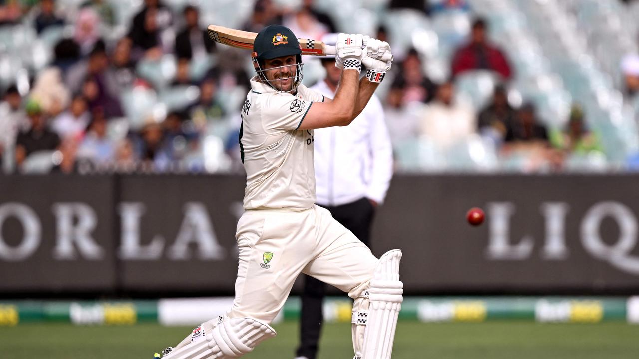 Australian batsman Mitch Marsh hits a cover drive on the third day of the second cricket Test match between Australia and Pakistan at the Melbourne Cricket Ground (MCG) in Melbourne on December 28, 2023. (Photo by William WEST / AFP)