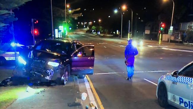 A Jeep, containing a man, 20, a boy, 14, and a third person, crashed into a set of traffic lights on Spit Rd at Beauty Point during a police chase. Picture: 7News