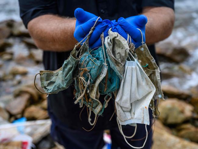 Face mask litter collected on Lantau island, Hong Kong. The surge in mask wearing during the coronavirus pandemic has thrown up a potent new threat to wildlife. Picture: AFP