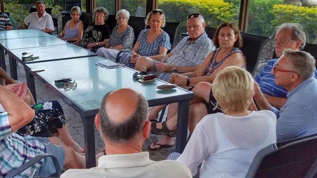 Eddy Sarroff (far right) talking to Southport residents about their protest against a second Gold Coast casino.