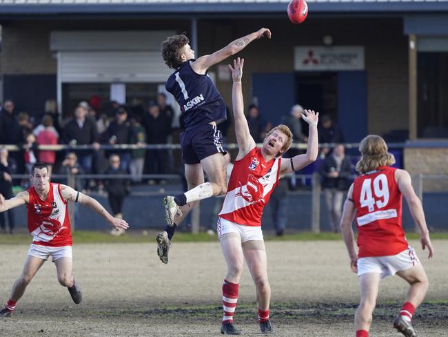 MPNFL: Edithvale-Aspendale’s Zack O’Neill jumps over Lachlan Croad of Sorrento. Picture: Valeriu Campan