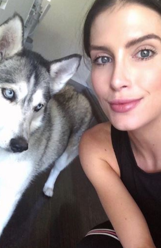 Erin Holland shares a snap with her adorable husky — showing off her flawless complexion. 