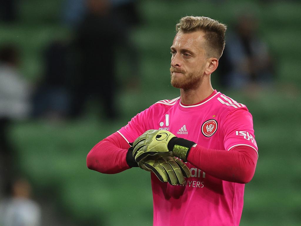 Wanderers goalkeeper Lawrence Thomas removes his gloves after his side’s record loss to Melbourne City. Picture: Getty Images