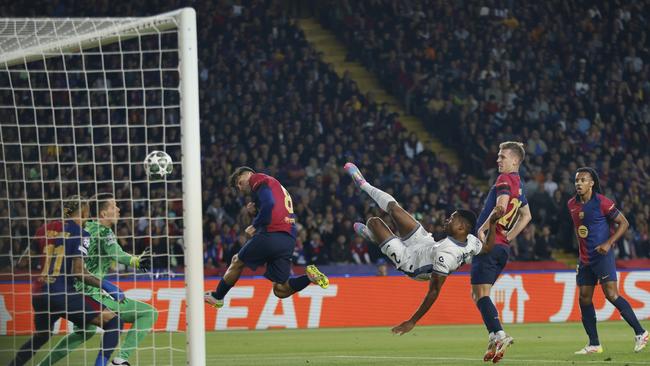 Inter Milan's Denzel Dumfries, third right, scores his side's second goal during the Champions League semifinal first leg against Barcelona. (AP Photo/Joan Monfort)